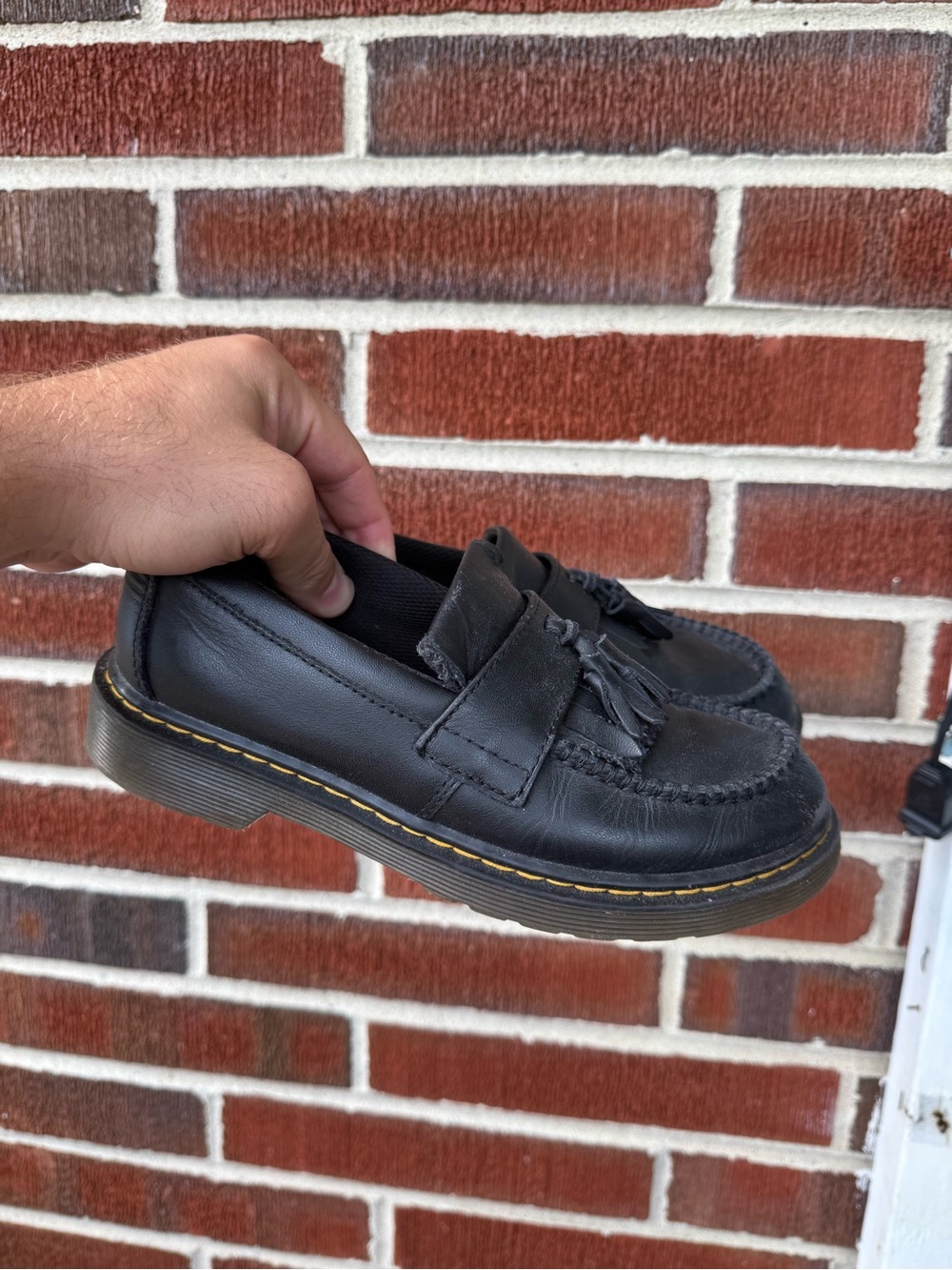Dr. Martens Black Leather Tassel Loafers with Yellow Stitching